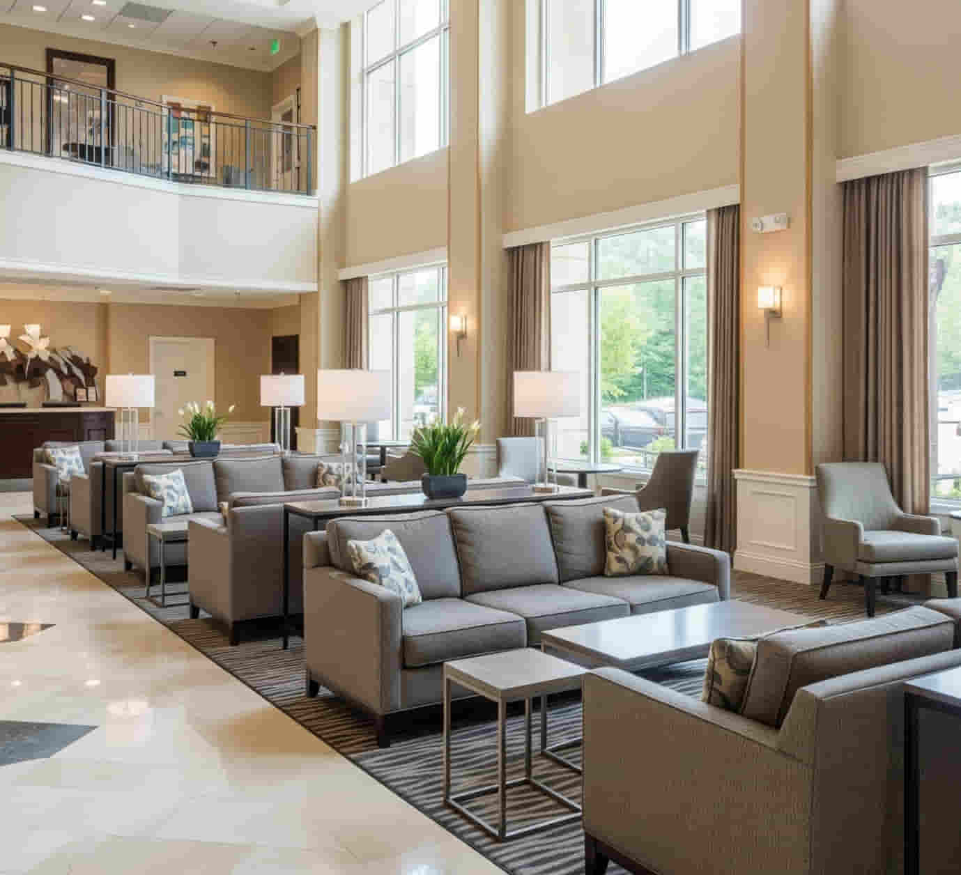 Upscale hotel lobby with durable commercial sofas and lounge chairs designed for high traffic.